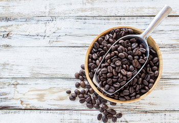 Big stainless steel scoop of coffee beans
