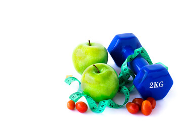 Green apple, dumbbelle and measuring tape on white background
