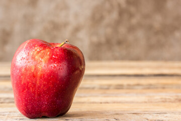 fresh red apple on wooden table