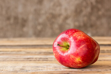 fresh red apple on wooden table