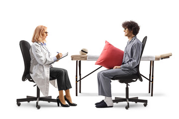 Man in pajamas talking to a female doctor