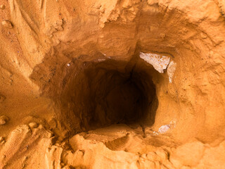 A Sandy Cave Hole in the middle of a desert