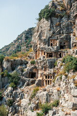 Fototapeta na wymiar Ruins of old lycian rock tombs in ancient Myra city near town Demre, Antalya province