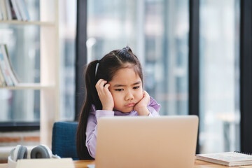 Young Girl Bored with Online Learning.