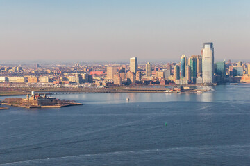 New York City skyline and Hudson River as seen from Helicopter at sunset, One World Trade Center...