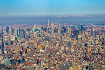 New York City skyline and Hudson River as seen from Helicopter at sunset, One World Trade Center...