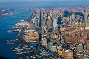 New York City skyline and Hudson River as seen from Helicopter at sunset, One World Trade Center view. Aerial view of Manhattan, Battery Park, freedom tower, Downtown, Finance center - obrazy, fototapety, plakaty