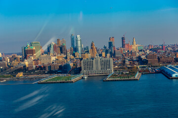 New York City skyline and Hudson River as seen from Helicopter at sunset, One World Trade Center view. Aerial view of Manhattan, Battery Park, freedom tower, Downtown, Finance center