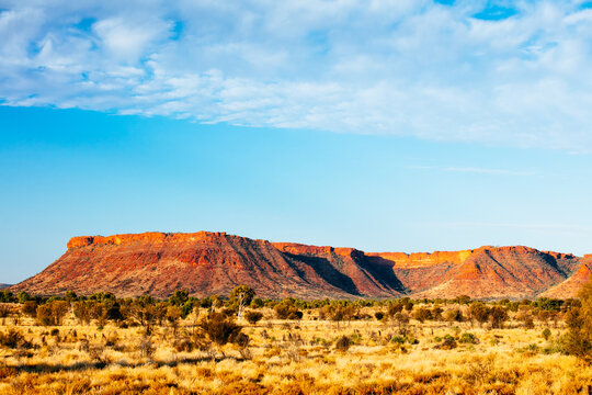 Sunset colours on the rising landforms above the plains near Kings Canyon in Central Australia
