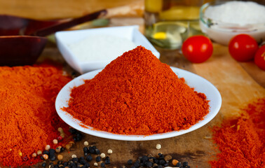 Powdered dried red pepper in a white bowl
