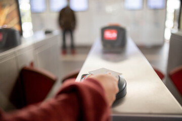 Close-up of tapping on with an Opal Card at a Sydney train station