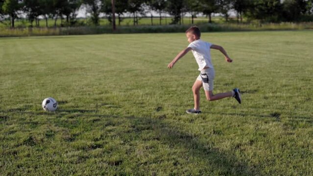 Dad playing rugby with kids outdoors 