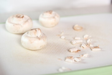 Fototapeta na wymiar Peeling Mushrooms. Making Chicken, Cheese and Leek Parcel Series.