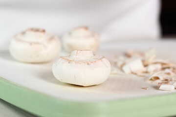 Fototapeta na wymiar Peeling Mushrooms. Making Chicken, Cheese and Leek Parcel Series.