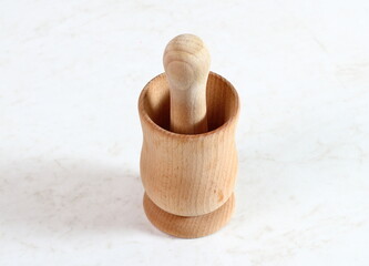 Wooden mortar and pestle on table