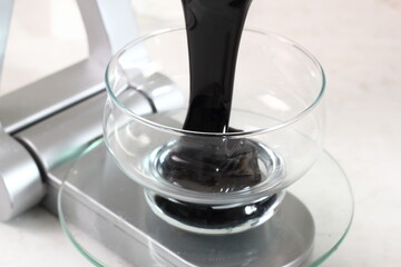 Weighing Molasses. Making Treacle Pie Series.