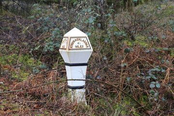 An old vintage mile post situated in The Trossachs, Stirlingshire, Scotland four and a half miles from Stronachlachar.