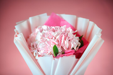 Pink and White Flower Bouquet Wrapped in Paper
