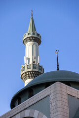 Minaret of the mosque against blue sky in Dubai, UAE