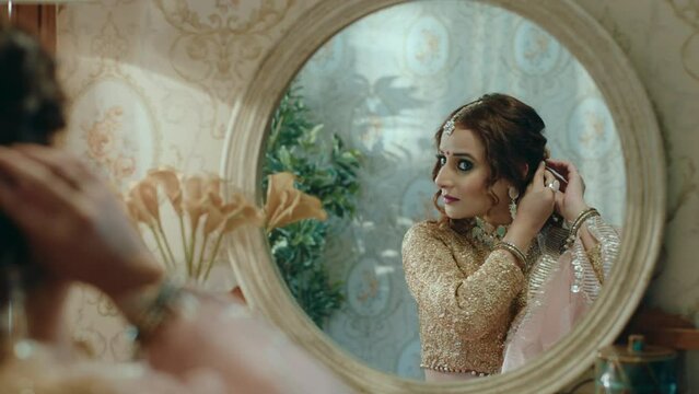 Hindi woman in a mirror reflection