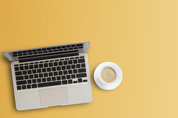 Top view modern workspace with coffee cup and laptop computer on orange color background.