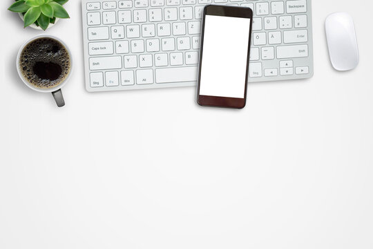 Smartphone,mini keyboard,mouse and hot coffee on white office desk background.