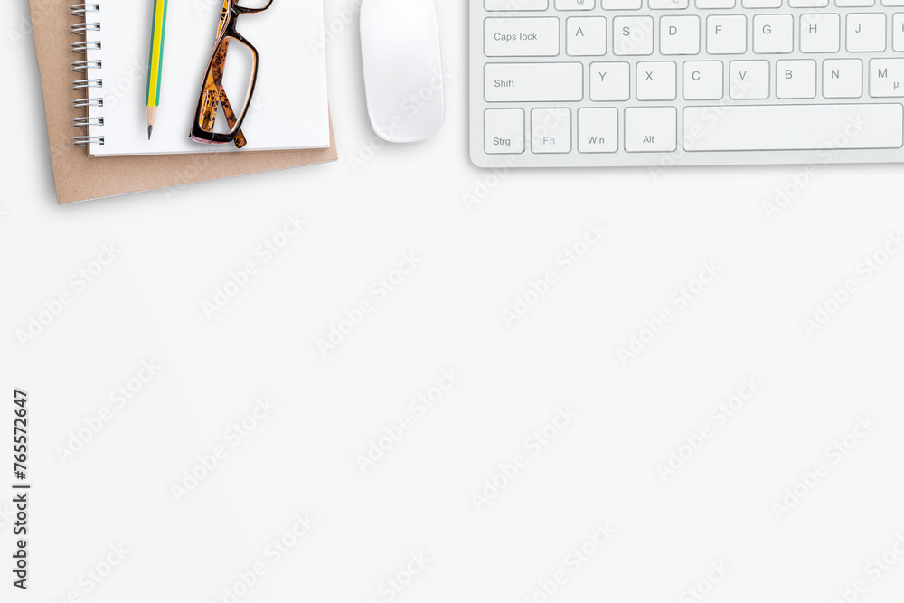 Wall mural wireless mouse and mini keyboard with office tools and glasses on white office desk background.