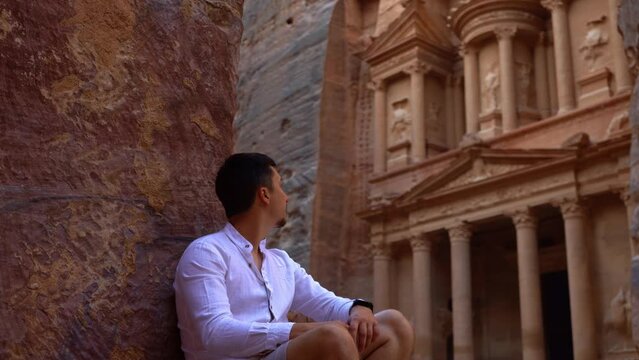 Young Man Enjoying The View On The Treasury In Petra, Jordan