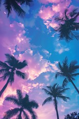 Fototapeta na wymiar Palm trees are dark silhouettes against a vibrant purple and blue sky, creating a striking contrast in the tropical landscape