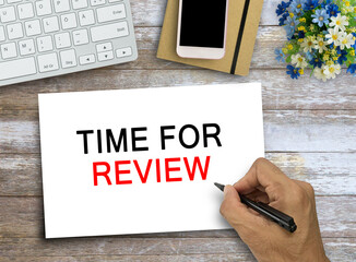 Online Reviews Evaluation time for review Inspection Assessment Auditing text on wood table...
