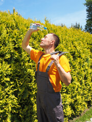 Man Gardener Pouring Bottled Water Over His Head