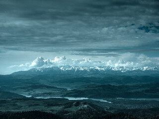 View of High Tatras and Lake Czorsztyn from Gorce Mountains