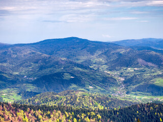 View of Village Ochotnica Dolna in Gorce mountains from summit of mountain Luban. - obrazy, fototapety, plakaty