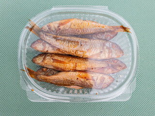 Smoked lamb fish packed on the table