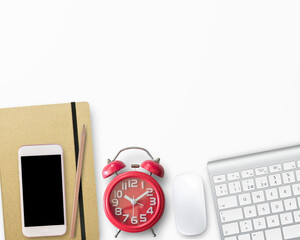 Blank notebook and red alarm clock on work space. Office desk for business concept.