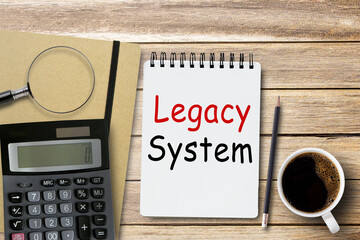 Legacy System, Text on notebook in office desk workplace background.