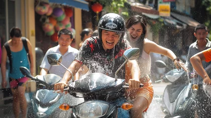 Fototapete Rund Songkran celebration Thailand Bangkok, Chiang Mai, New Yeah celebration in Thailand, Water fights all around the country.  Couple on the motor bike. The concept of Water Festival, splashing. © Natalia Schuchardt