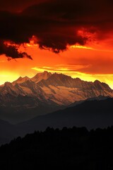 Obraz premium The sun dips below the horizon, casting a warm glow over the distant mountains