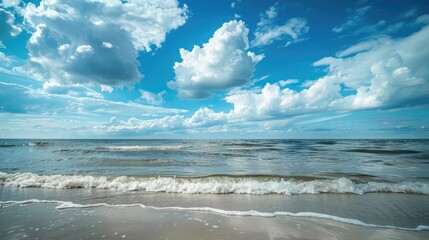 calm blue baltic sea against a blue sky with white cirrus clouds and an empty sandy beach - obrazy, fototapety, plakaty
