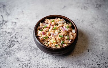 White beans red onion salmon salad in a bowl