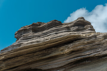 The rock formations and cliffs at Lanai Lookout are volcaniclastic deposits, that are created when a volcano erupts and the ash falls onto the ground. Limestone and basalt fragments. Honolulu Oahu 