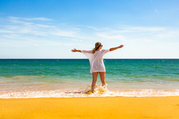 Beach holiday - beautiful woman walking on sunny beach
- 765605246