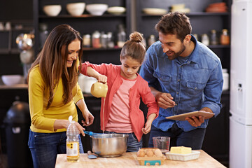 Family, kitchen and tablet for baking with care, recipe online with ingredients for cake or dessert...