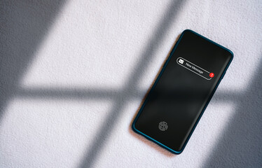 Smartphone with new message notification on screen. Communication business technology. Inbox view. New e-mail on mobile smartphone.