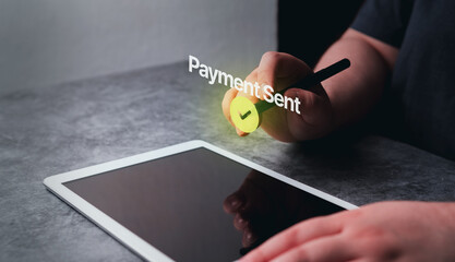 Woman use tablet with the hologram of payment sent. Concept of financial transactions with digital...