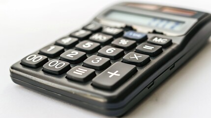 A black calculator appears isolated on a white background - obrazy, fototapety, plakaty