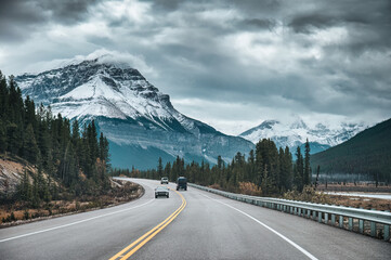 Road trip among rocky mountains in the forest on gloomy at Banff national park, Canada