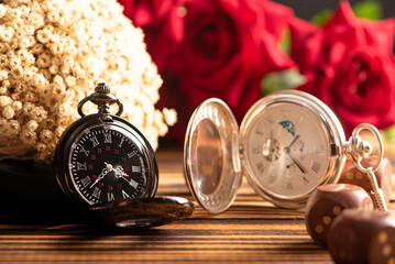 Antique clock and accessories, old and beautiful clock and accessories on rustic wood and dark...