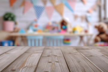 Naklejka na ściany i meble Wooden table with a blurred background of a children's playroom with toys and colorful decorations.