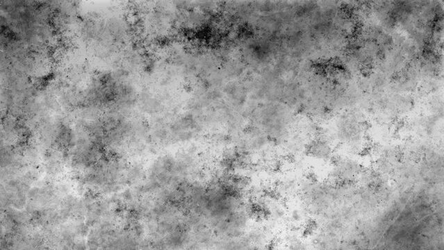 Abstract monochrome background moving ink with grunge texture  on grey cement wall copy space of textures with dark dust and flickering ink stains. Chaotic movement of strokes with flickering